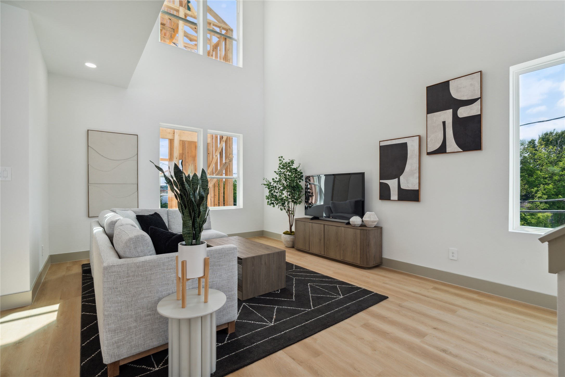 2943 Delafield Street Houston, TX 77023 - Photo 12 of 41 Soaring ceilings and walls of natural light create an atmosphere of airy elegance in this open-concept living space.