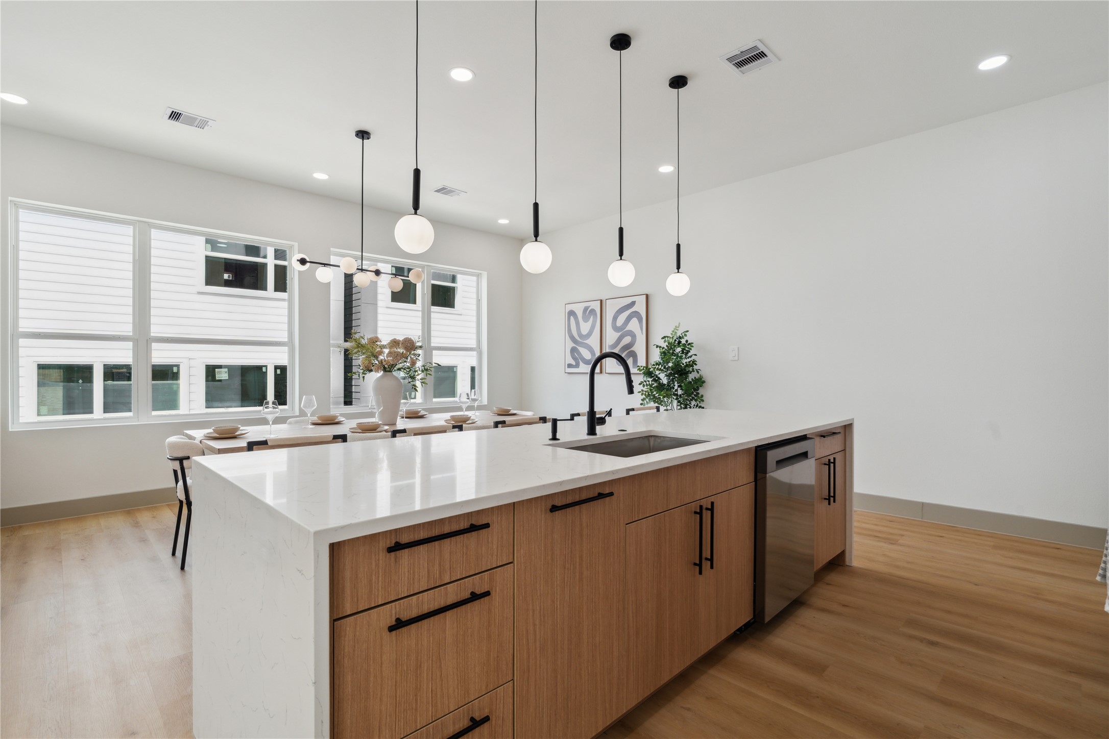 2943 Delafield Street Houston, TX 77023 - Photo 17 of 41 Where morning coffee meets evening gatherings—this island is more than a prep space, it's a place to connect, unwind, and entertain.