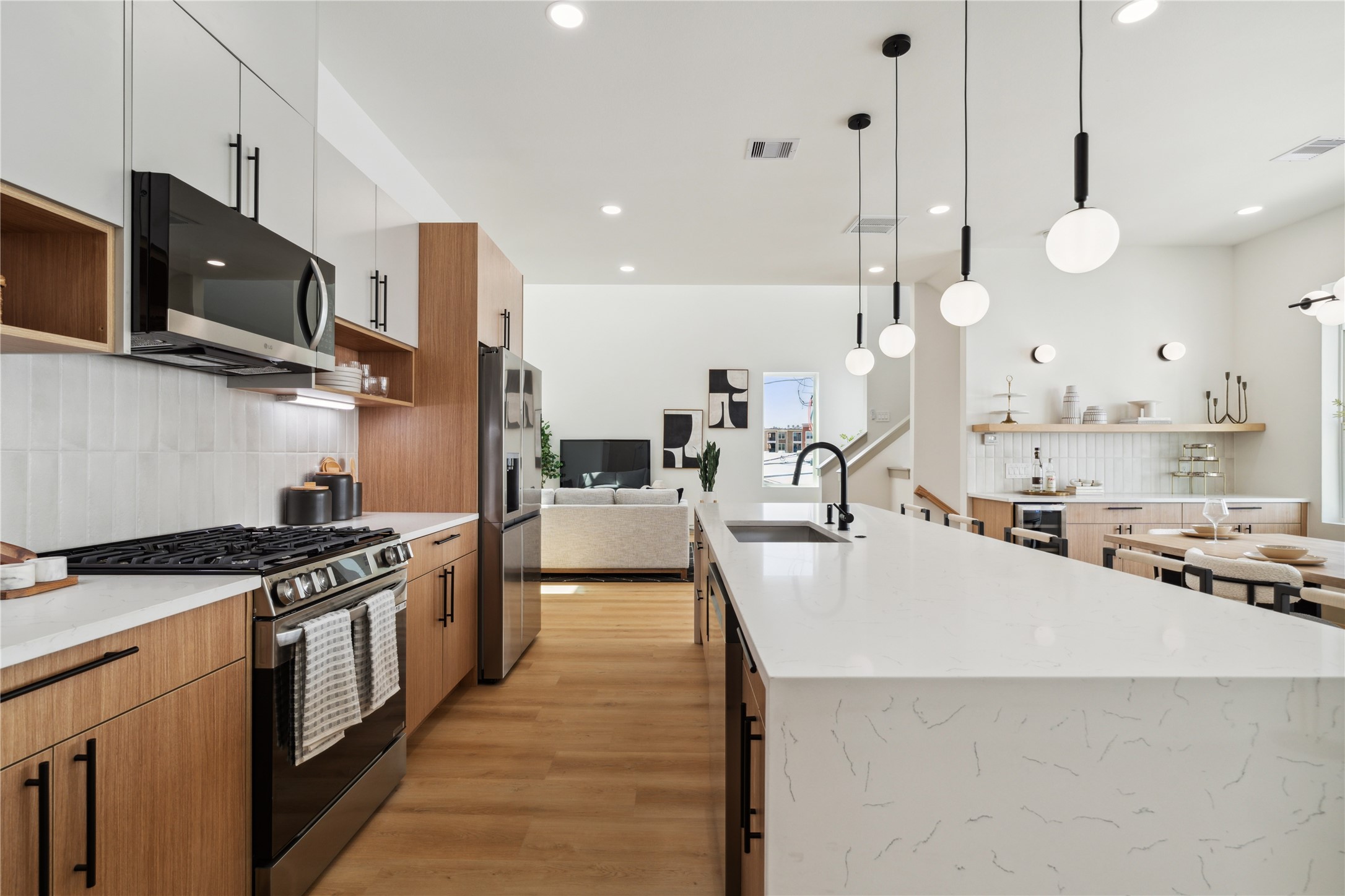 2943 Delafield Street Houston, TX 77023 - Photo 19 of 41 With uninterrupted sightlines from the island to the living room, this layout is designed for seamless hosting and everyday ease.