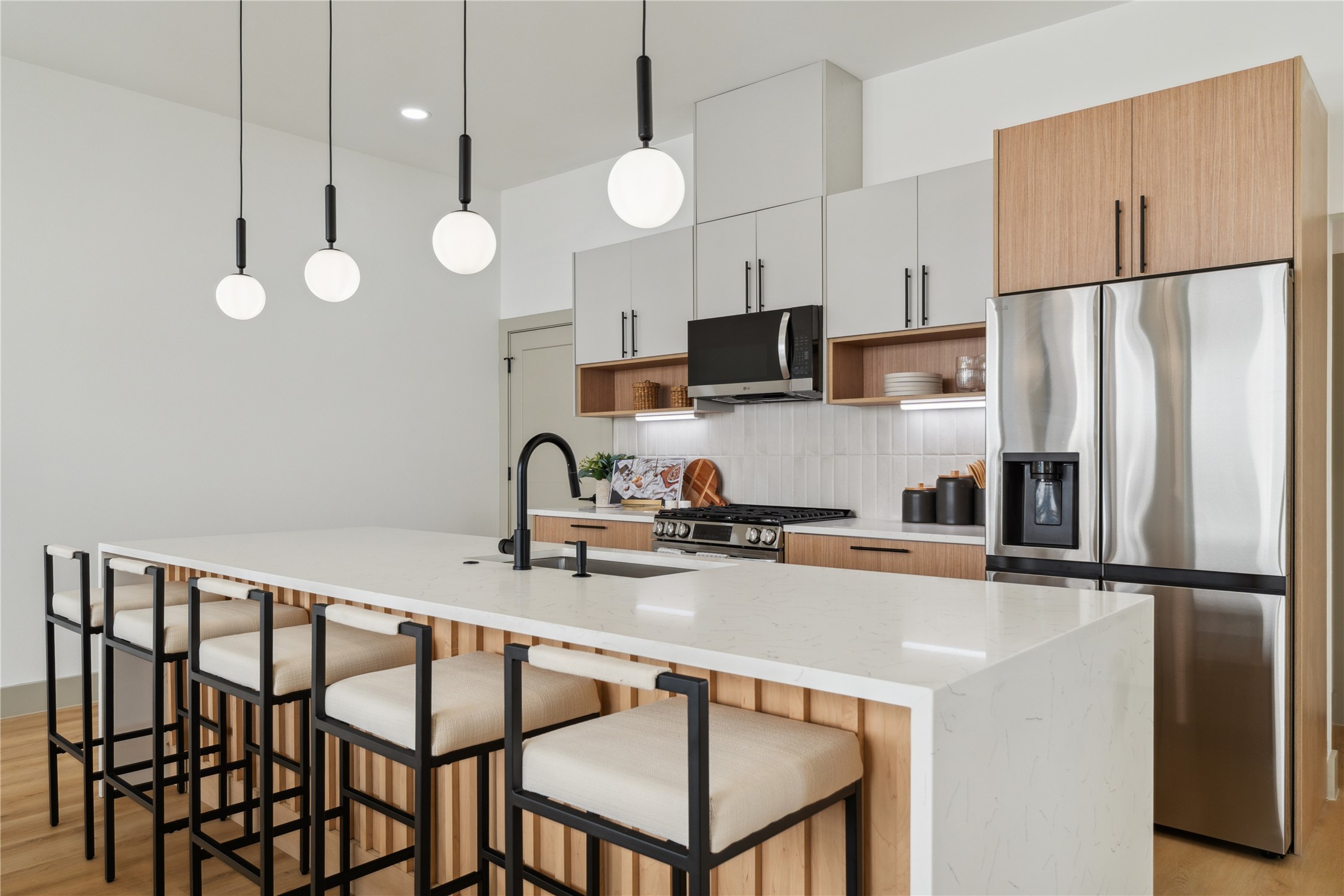 2943 Delafield Street Houston, TX 77023 - Photo 20 of 41 The warmth of fluted wood and the coolness of stone strike the perfect balance—refined yet inviting, just like the rest of the home.