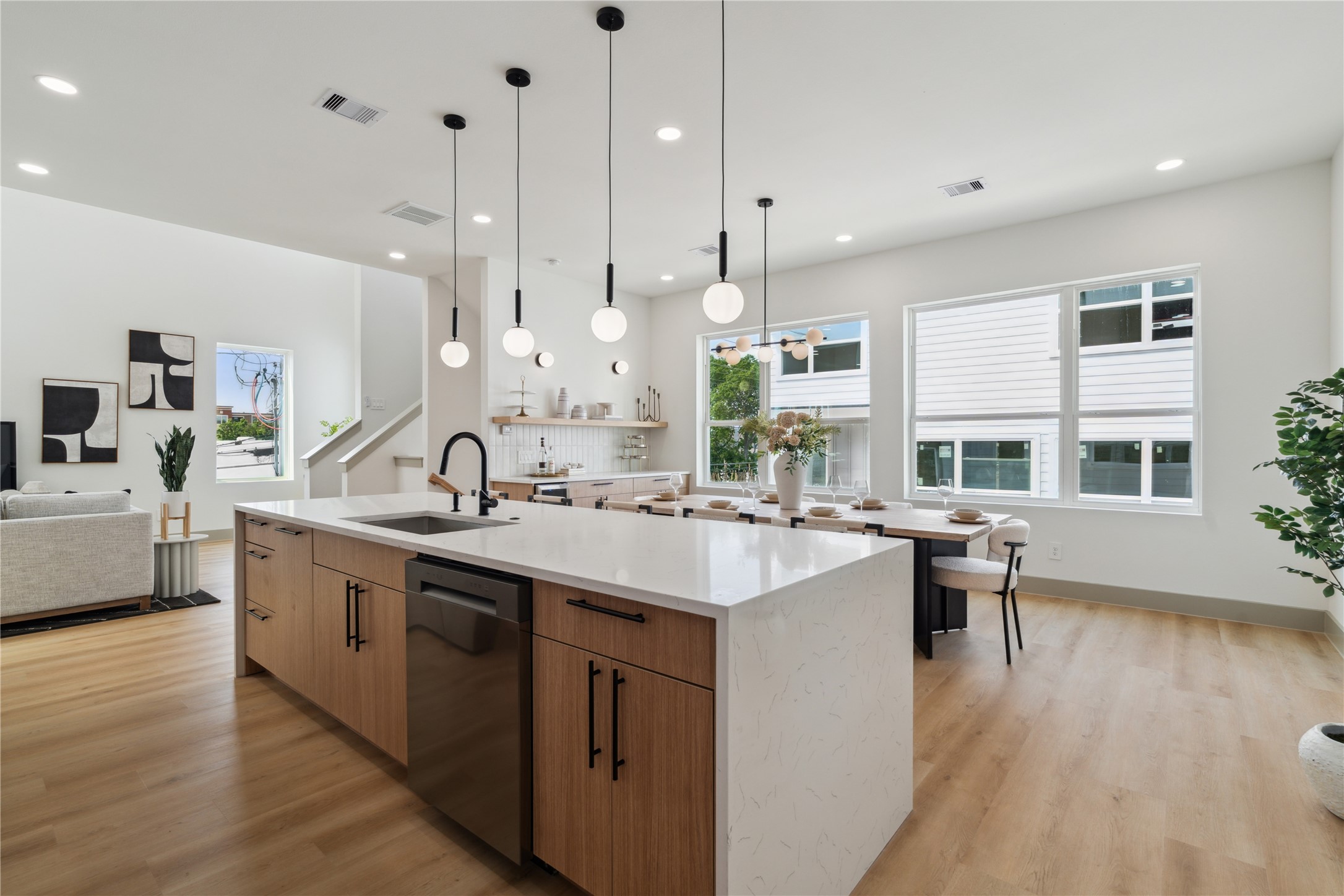 2943 Delafield Street Houston, TX 77023 - Photo 21 of 41 Bathed in natural light, this open-plan space is perfect for slow mornings, celebratory dinners, and everything in between.