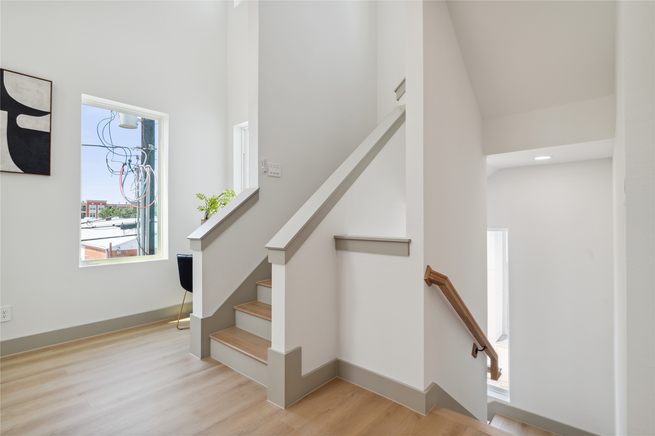 2943 Delafield Street Houston, TX 77023 - Photo 24 of 41 Elevated baseboards and soft neutral hues add depth and dimension to this light-filled vertical connection.
