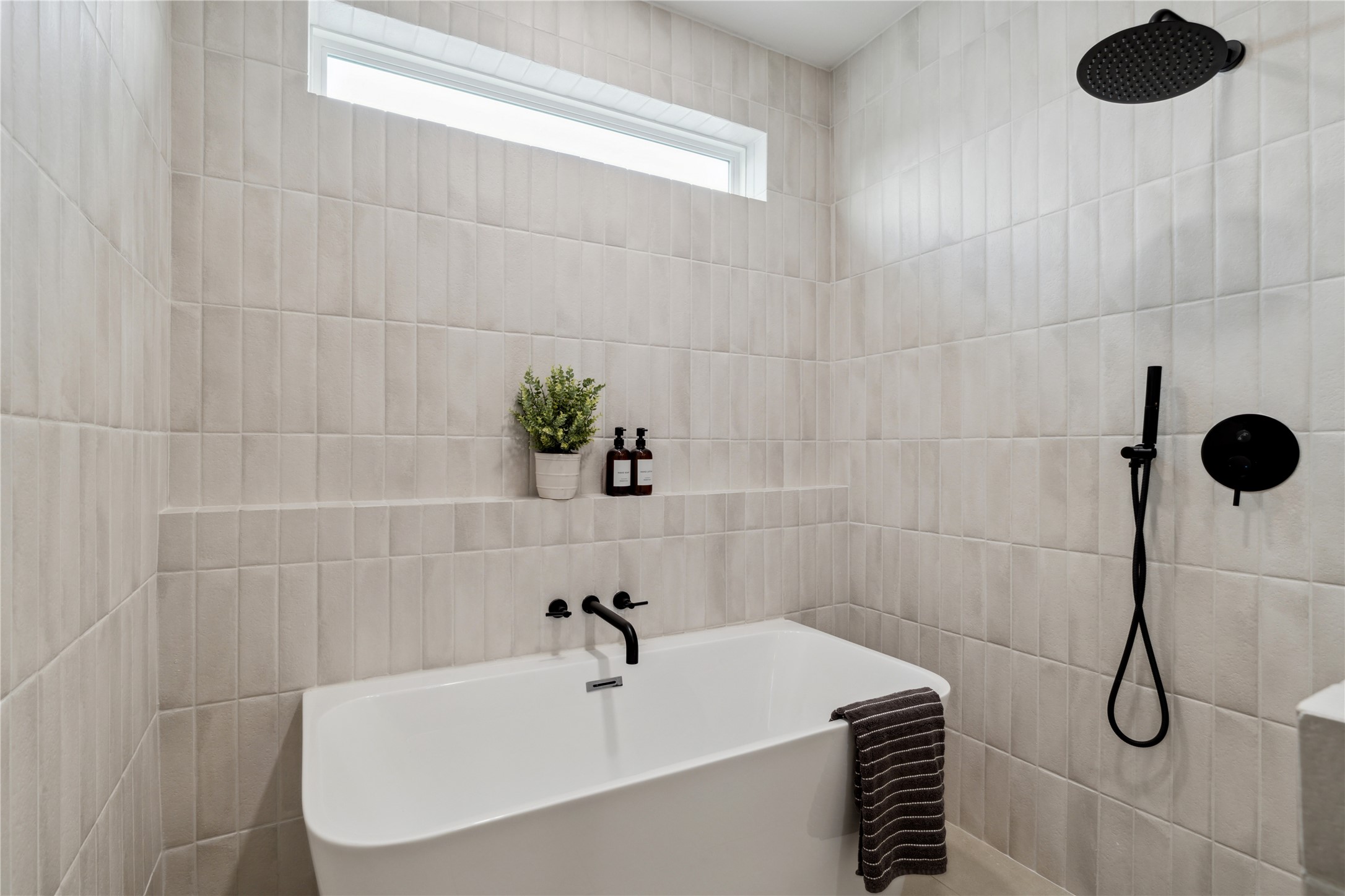 2943 Delafield Street Houston, TX 77023 - Photo 31 of 41 Thoughtfully composed and quietly indulgent, this space invites long soaks, quiet mornings, and the rhythm of reset.