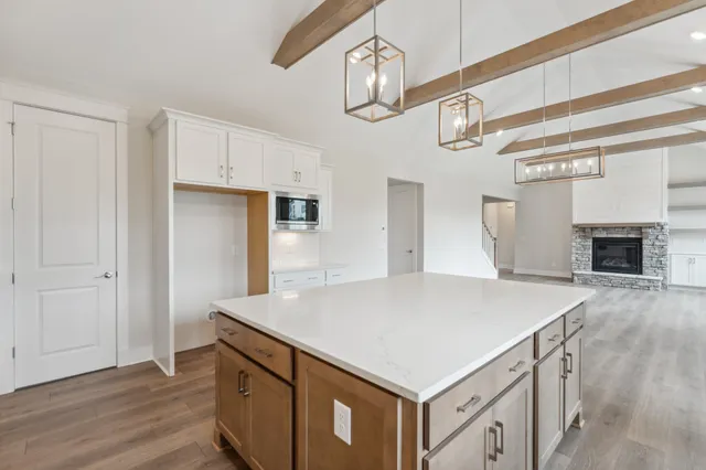 a kitchen with white cabinets and white appliances