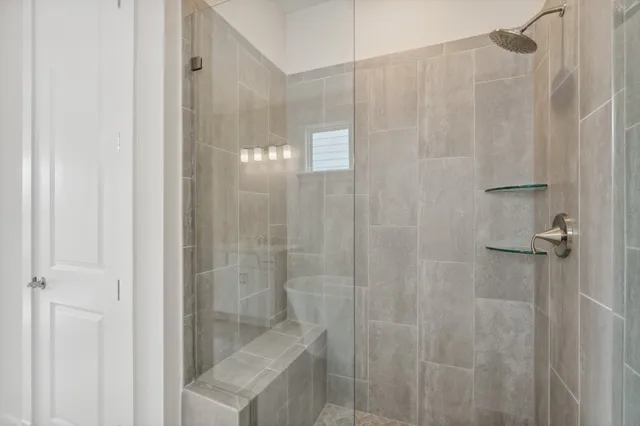 a view of walk in closet with wooden floor
