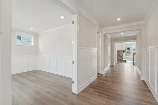 a view of a livingroom with wooden floor and a window