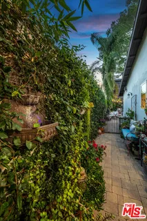 a potted plant sitting in front of a house