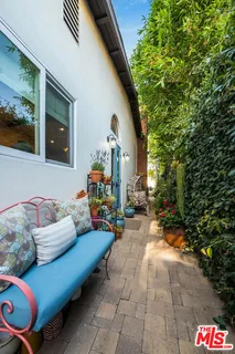 an aerial view of a house with outdoor space