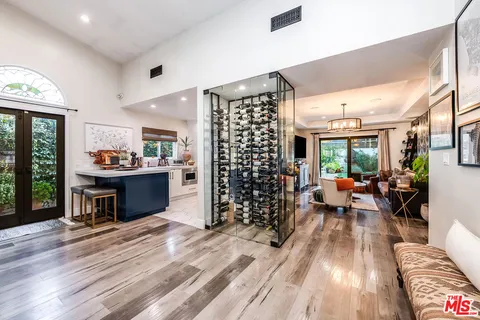 a living room filled with furniture and a large window