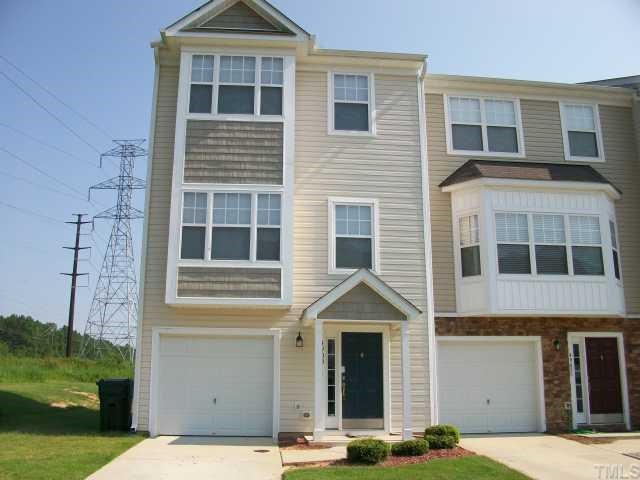 4903 Midstone Lane Raleigh, NC 27610 - Photo 1 of 11 a front view of a house with a yard
