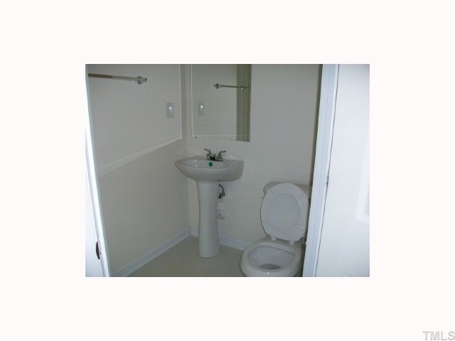 4903 Midstone Lane Raleigh, NC 27610 - Photo 11 of 11 a bathroom with a sink and mirror