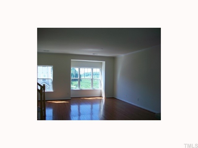 4903 Midstone Lane Raleigh, NC 27610 - Photo 4 of 11 a view of an empty room with windows