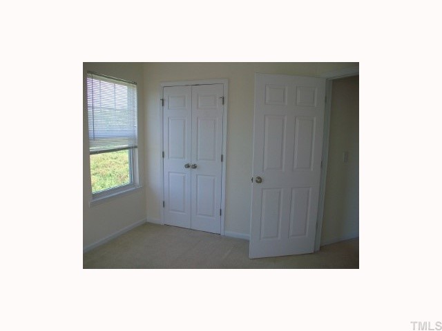 4903 Midstone Lane Raleigh, NC 27610 - Photo 10 of 11 a view of an empty room with closet