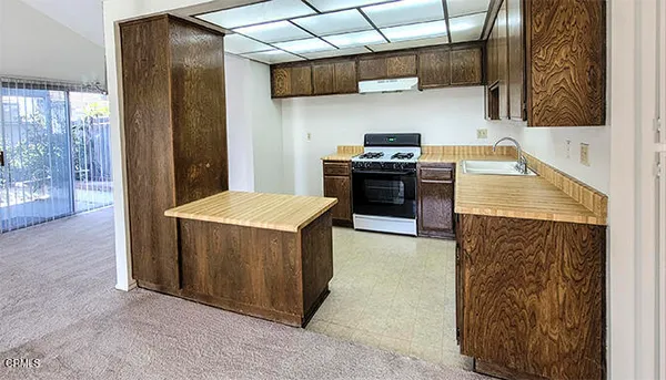 a view of a kitchen with a sink