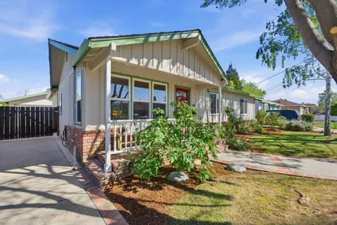 a front view of a house with garden