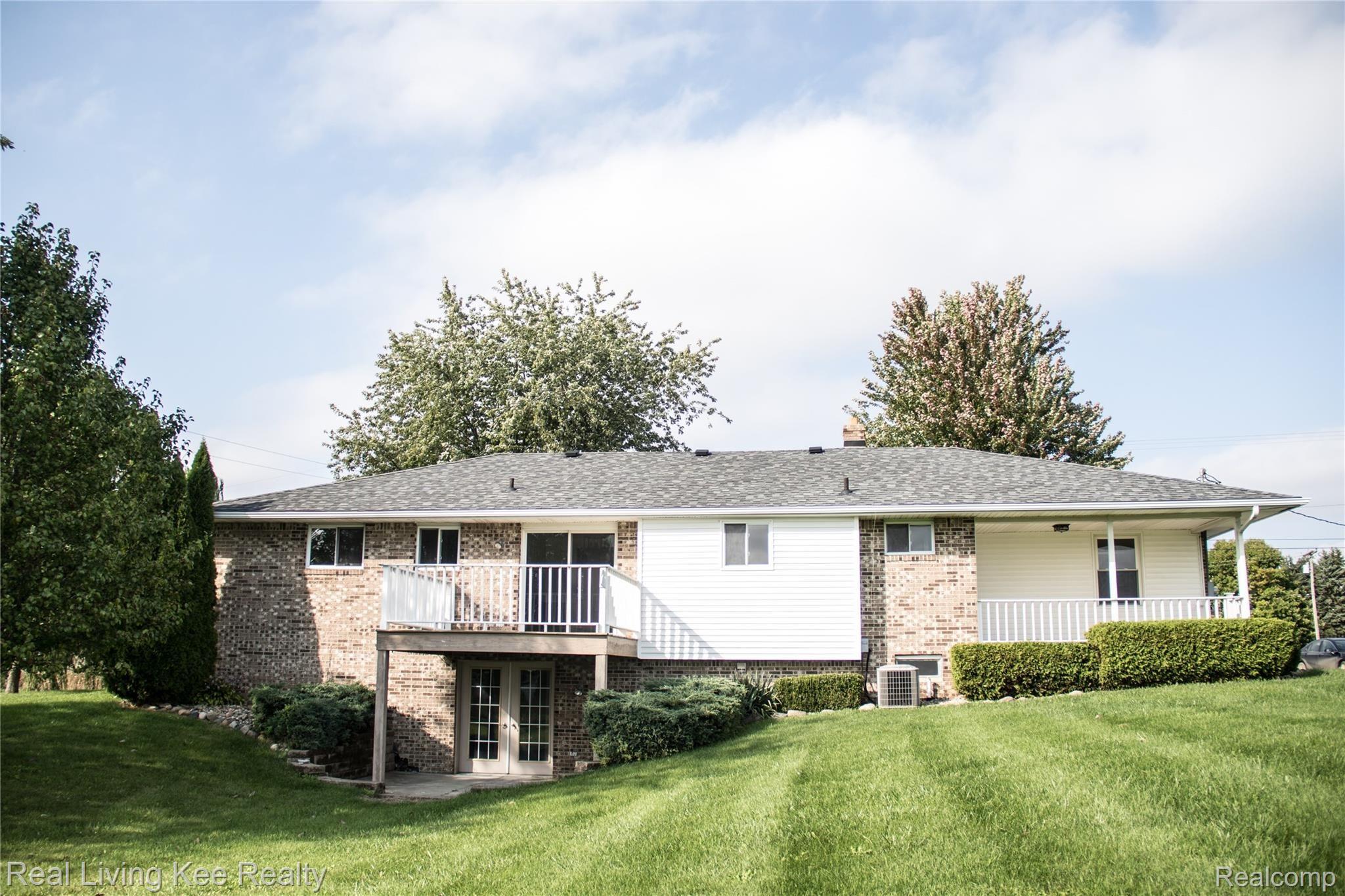16475 Almont Road Allenton, MI 48002 - Photo 5 of 43 Back of home 2.jpg