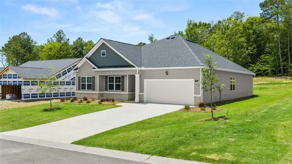a aerial view of a house with a yard porch and sitting area