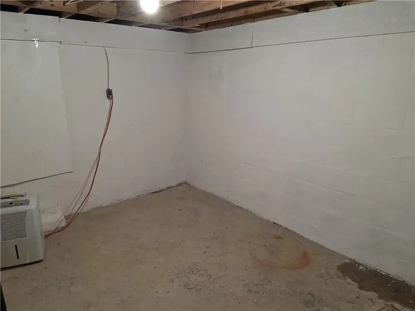 a view of staircase with white walls