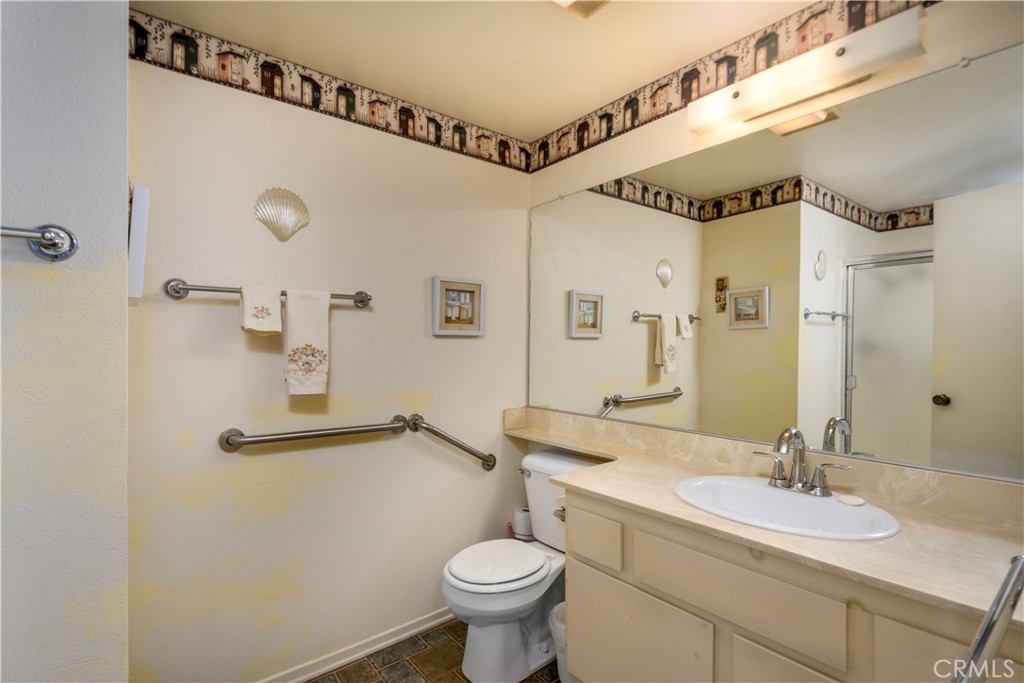 13515 Avenida Santa Tecla, Unit 210D La Mirada, CA 90638 - Photo 13 of 26 a bathroom with a sink mirror vanity and toilet