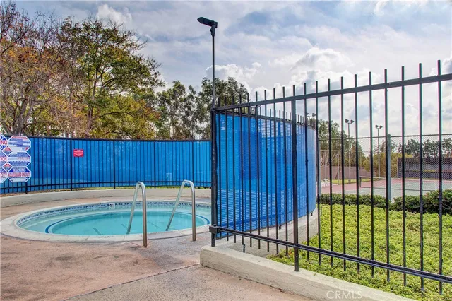 a view of a backyard with a fence