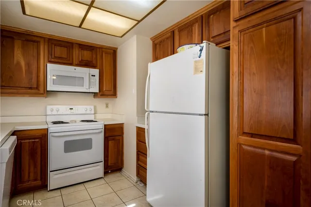 a white refrigerator freezer sitting in a kitchen