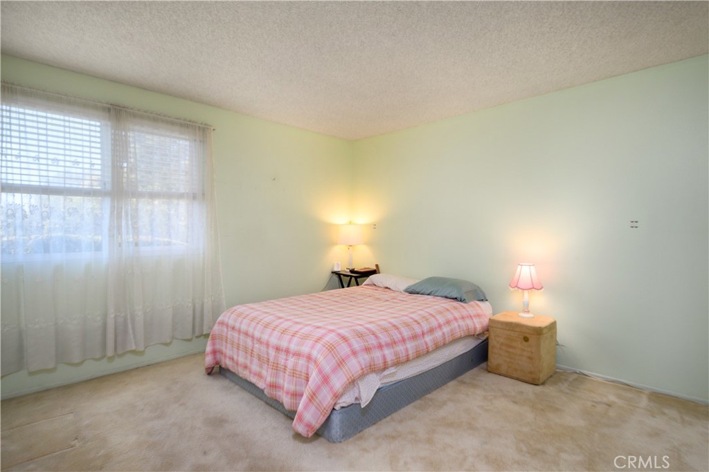 13515 Avenida Santa Tecla, Unit 210D La Mirada, CA 90638 - Photo 9 of 26 a bedroom with a bed and a window