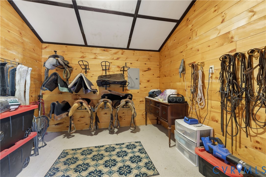 25181 West Soap Stone Road Jetersville, VA 23083 - Photo 44 of 54 Wood-paneled room featuring a concrete floor, slop