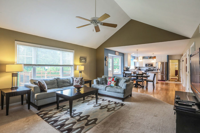 2639 Saltmeadow Road Naperville, IL 60564 - Photo 11 of 25 a living room with furniture and a large window