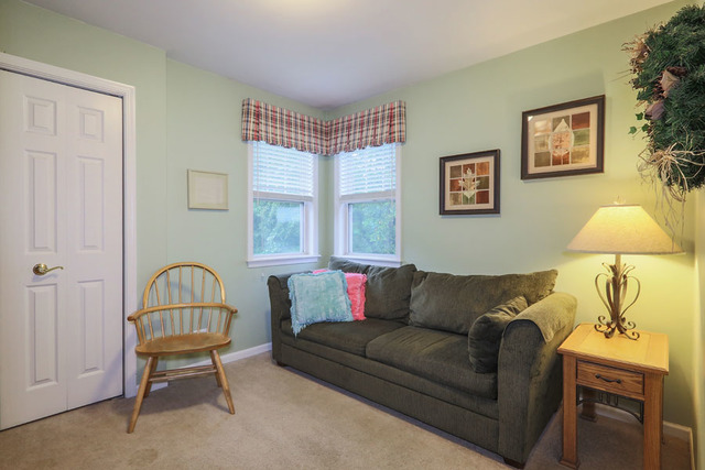 2639 Saltmeadow Road Naperville, IL 60564 - Photo 12 of 25 a living room with furniture and a window