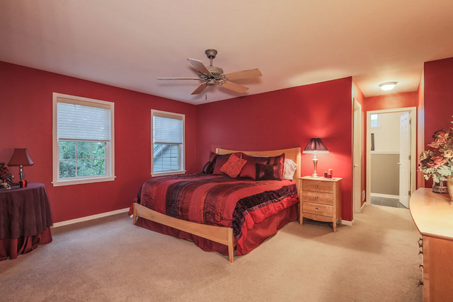 2639 Saltmeadow Road Naperville, IL 60564 - Photo 13 of 25 a bedroom with a bed and a chandelier