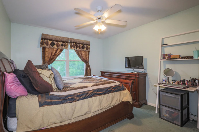 2639 Saltmeadow Road Naperville, IL 60564 - Photo 16 of 25 a bedroom with a bed and a window