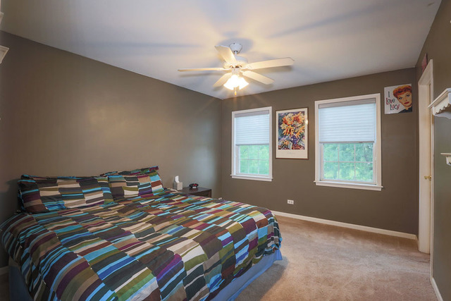 2639 Saltmeadow Road Naperville, IL 60564 - Photo 17 of 25 a bedroom with a bed and a window