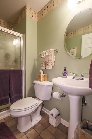 2639 Saltmeadow Road Naperville, IL 60564 - Photo 19 of 25 a bathroom with a sink toilet and shower
