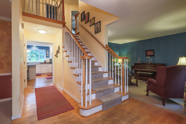 2639 Saltmeadow Road Naperville, IL 60564 - Photo 2 of 25 a view of a livingroom with furniture and stairs