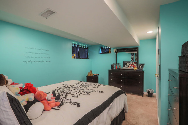 2639 Saltmeadow Road Naperville, IL 60564 - Photo 21 of 25 a bedroom with a bed and a dresser in it