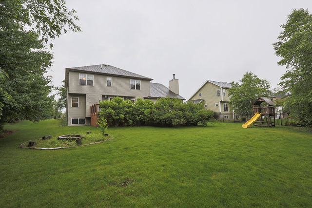 2639 Saltmeadow Road Naperville, IL 60564 - Photo 22 of 25 a view of a house with a yard and sitting area