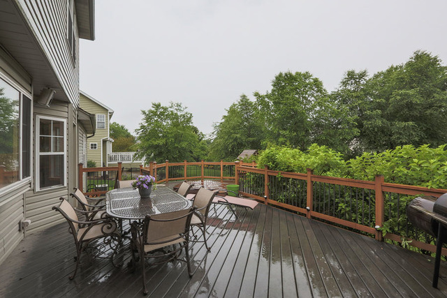 2639 Saltmeadow Road Naperville, IL 60564 - Photo 24 of 25 a view of a roof deck with table and chairs and wooden floor