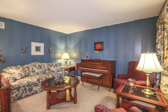 2639 Saltmeadow Road Naperville, IL 60564 - Photo 3 of 25 a living room with furniture and a lamp