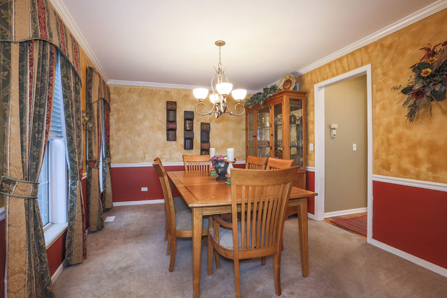 2639 Saltmeadow Road Naperville, IL 60564 - Photo 9 of 25 a view of a dining room with furniture and window