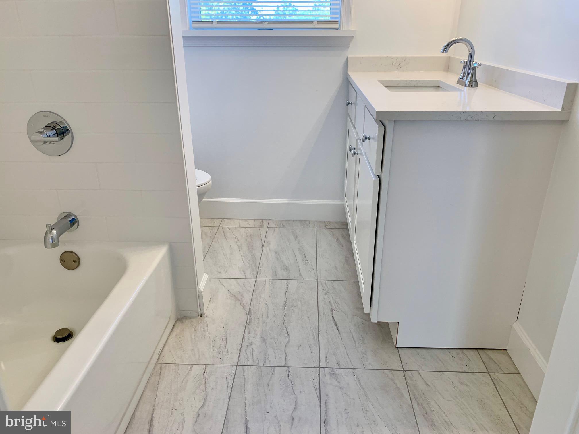 1029 North York Road Road, Unit D Willow Grove, PA 19090 - Photo 8 of 12 a bathroom with a sink and mirror