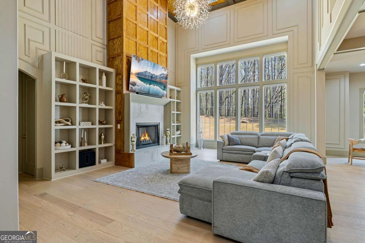 1315 Sandy Creek Road Tyrone, GA 30290 - Photo 18 of 100 a living room with furniture and a large window