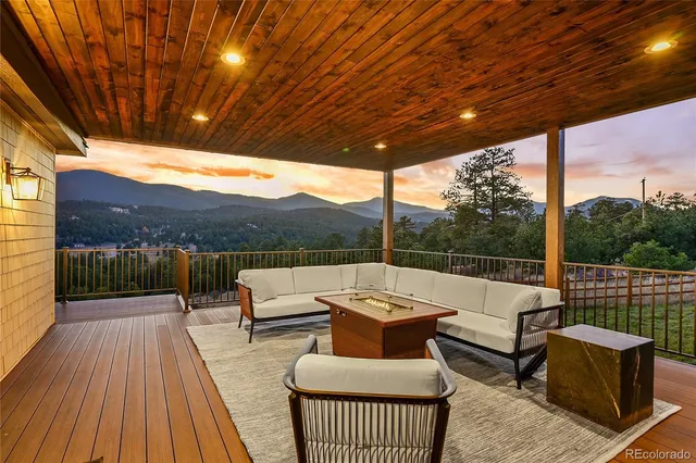 a outdoor living space with patio furniture and mountain view