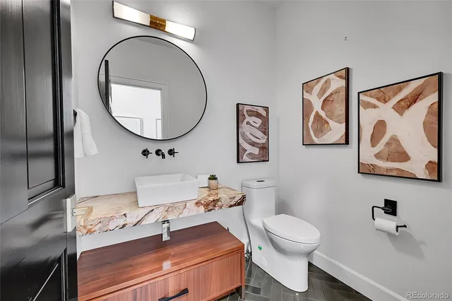 a bedroom with furniture and baby crib