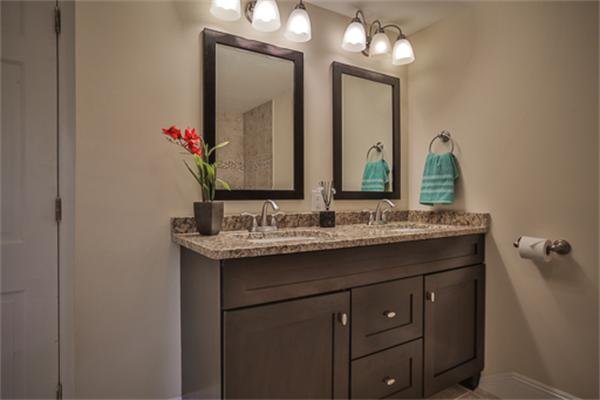 34 Ipswich Road Topsfield, MA 01983 - Photo 17 of 27 a bathroom with a granite countertop sink vanity and a mirror