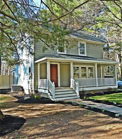 34 Ipswich Road Topsfield, MA 01983 - Photo 25 of 27 a front view of a house with a garden