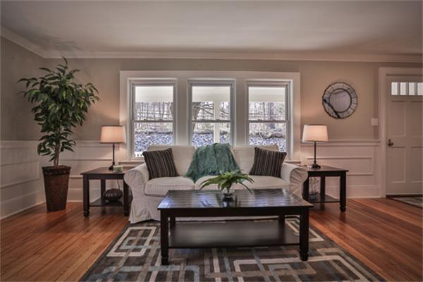 34 Ipswich Road Topsfield, MA 01983 - Photo 10 of 27 a living room with furniture a potted plant and a large window