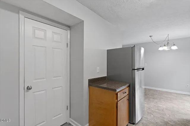 a utility room with faucet washer and dryer