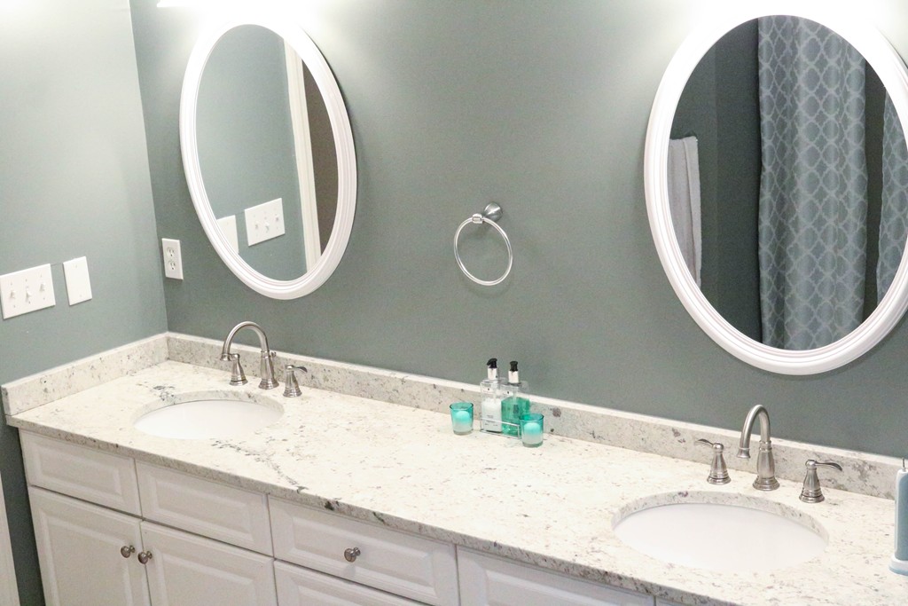 95 Jenkins Road, Unit 95 Bedford, NH 03110 - Photo 23 of 30 a bathroom with a sink and a mirror