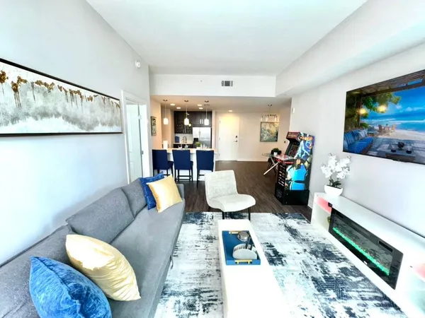 a living room with furniture and a flat screen tv