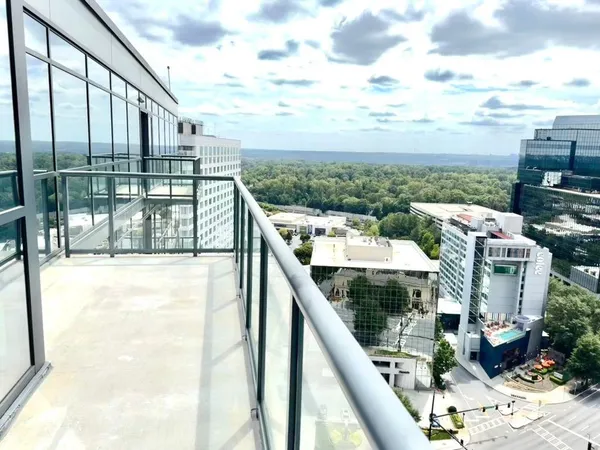 a view of balcony with furniture